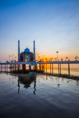 Mosque above the water in Indonesia during sunset