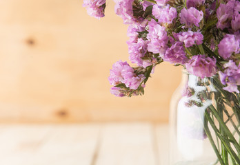 statice flower bouquet  on wood background