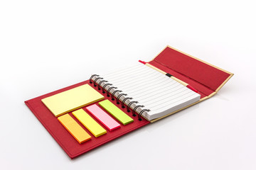 Red diary book on white background.