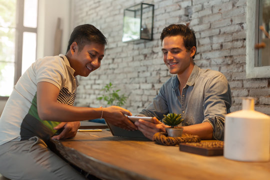 Two Men Using Tablet Computer at Table Cafe, Friends Guys