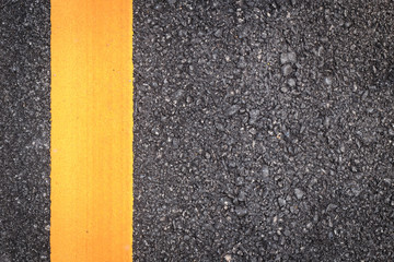 Fototapeta premium asphalt road texture with yellow stripe