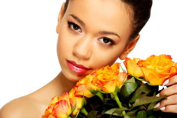 Fototapeta premium Beauty african woman with roses.