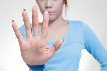 Asian women showing stop gesture