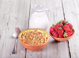 breakfast with cereals, milk and strawberries