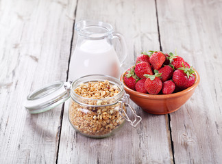 breakfast with cereals, milk and strawberries