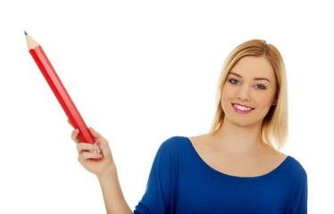 Woman pointing up with pencil.