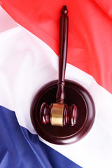 Wooden gavel on French flag background