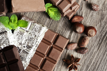 Set of spicy chocolate on wooden table, closeup