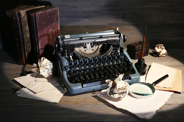Retro typewriter on wooden background