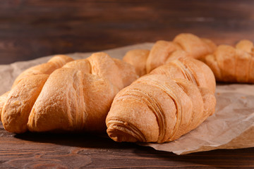 Delicious croissants on table close-up