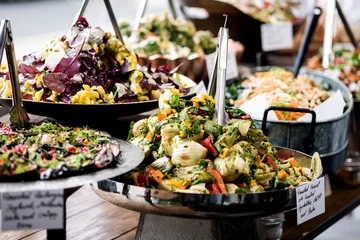 Gordijnen Yummy salads in restaurant. © stockyimages