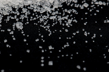 white sugar on a black background