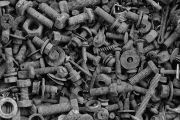 Old nut and bolts for background, Black and white photo.
