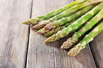 Fresh asparagus on wooden table, closeup