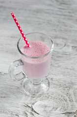 cocktail with strawberries, ice cream and milk in a glass mug 