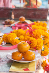 Orange on dish in chinese shrine for making merit.