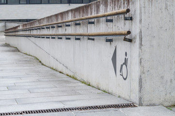 Using wheelchair ramp with physical impairment symbol