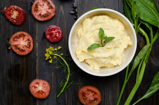 Mashed potato on wooden background