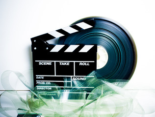 Movie clapper board and 35 mm film reel