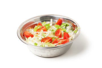 fresh salad in a metal plate on white