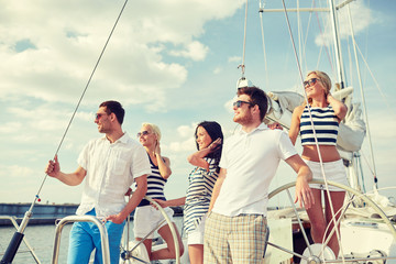 smiling friends sailing on yacht