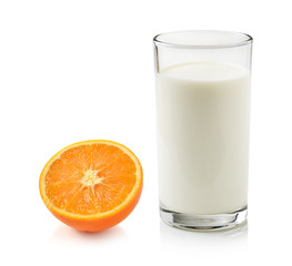 Glass of milk and half of orange isolated on white background