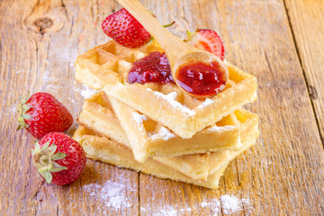 homemade waffles with strawberries maple syrup
