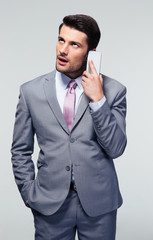 Bored businessman talking on the phone