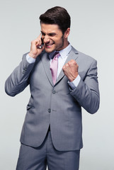 Happy businessman talking on the phone