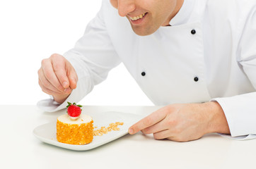 close up of male chef cook decorating dessert