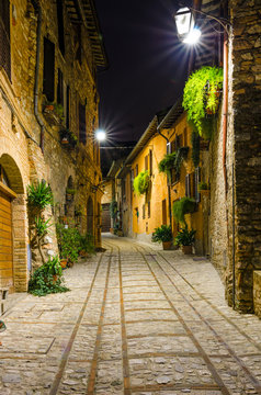 Paved alley of Spello (Umbria, Italy) in the night