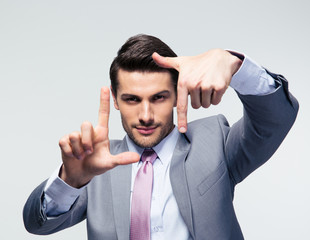 Businessman making frame gesture