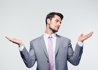 Businessman holding copyspace on the palms