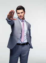 Businessman showing stop gesture