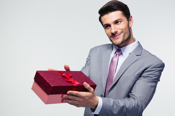 Businessman giving gift box