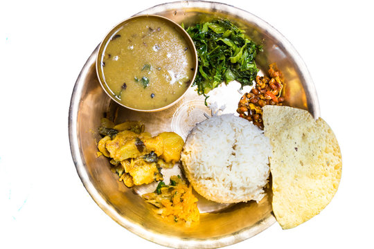 Dal Baht, traditional Nepali meal platter, isolated in white