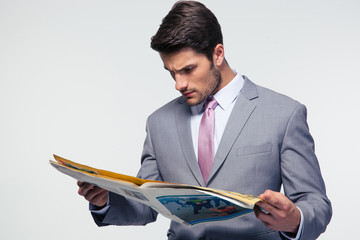Businessman reading magazine