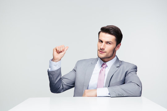 Confident Businessman Pointing Finger Back