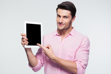 Businessman pointing finger on tablet computer screen