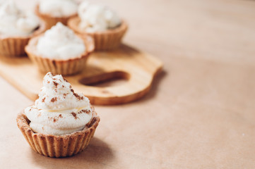 Little homemade oat tarts with whipped cream