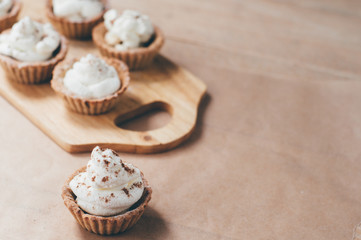 Little homemade oat tarts with whipped cream
