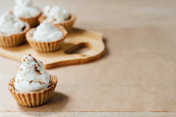 Little homemade oat tarts with whipped cream