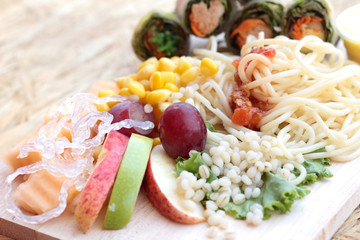 Pasta spaghetti with salad mix fruit and vegetables