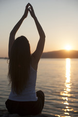 Relaxation on the water outdoors, woman with hands up