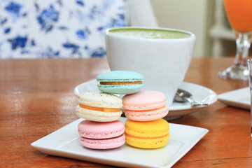 traditional french colorful macarons in a rows in a box