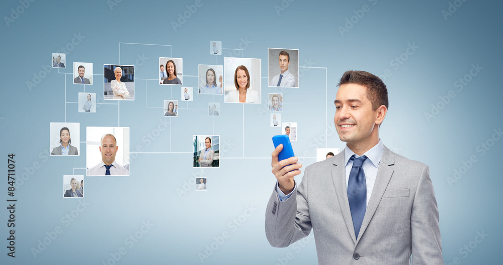 Sticker happy businessman texting message on smartphone