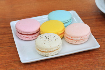 traditional french colorful macarons in a rows in a box