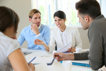 Fototapeta premium Business people meeting around table in modern space