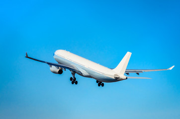 Commercial airplane taking off into the blue sky