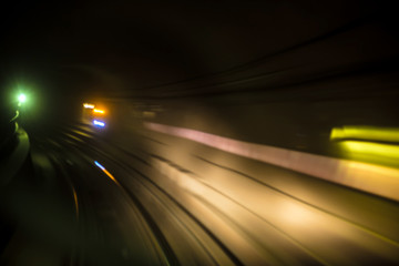 Blurred motion of New York City subway tube / tunnel going aroun
